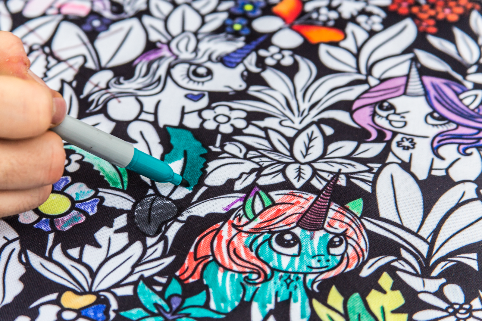 photo of someone coloring a Coloring Your Own Table Runner