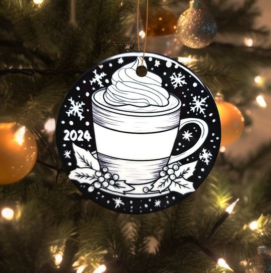 photo of uncolored hot cocoa side of the cozy christmas ornament uncolored, hanging on a christmas tree.