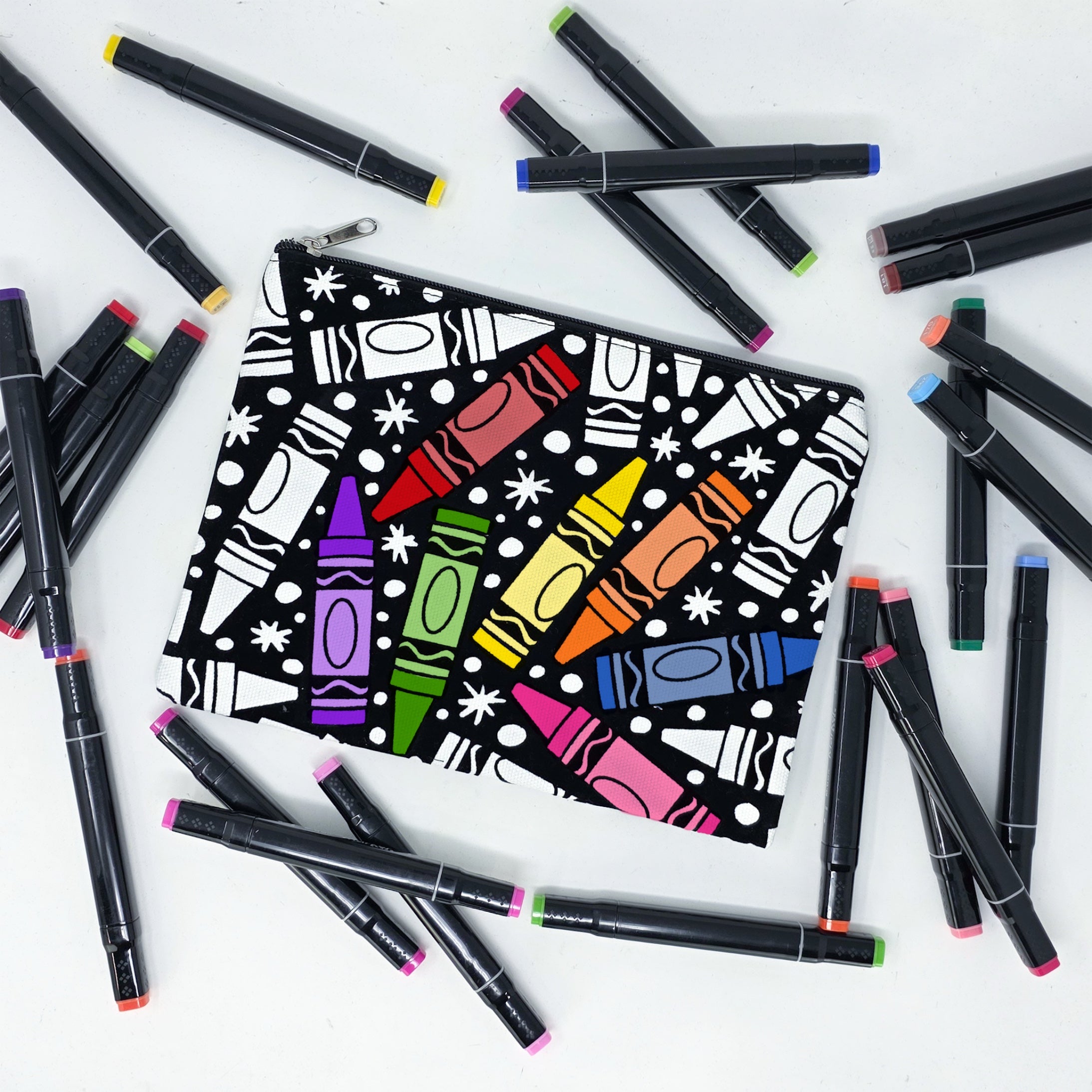 Partially colored coloring pouch with crayons on it