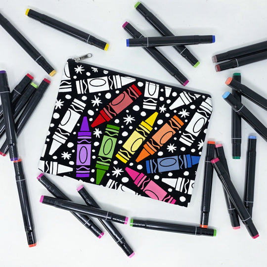 Partially colored coloring pouch with crayons on it