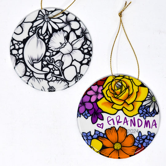 Photo of both sides of the floral abundance 2 color your own ornament. One side is colored with the name "grandma" written in the name space, the other side is all flowers uncolored. 