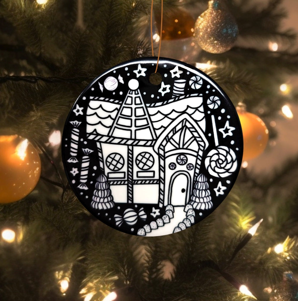 Photo of uncolored gingerbread house side of the gingerbread house ornament uncolored, hanging on a Christmas tree.