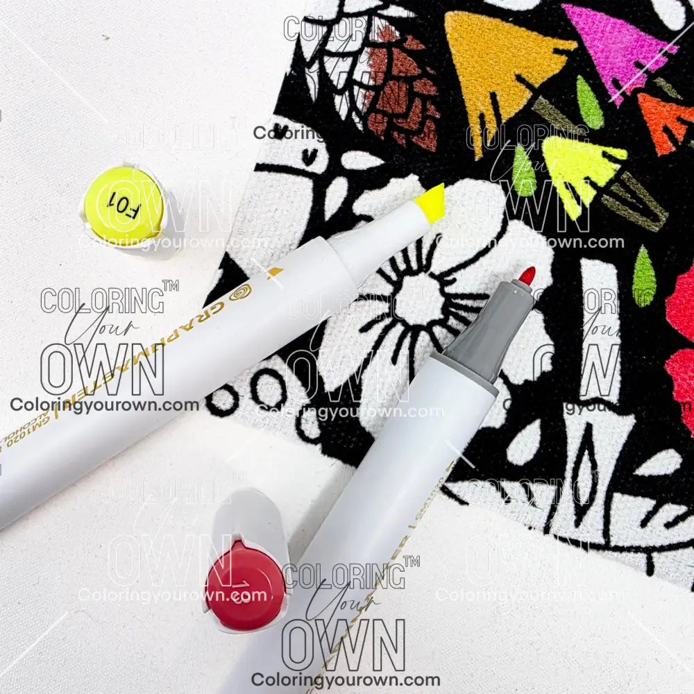 Two markers with colorful caps on a white surface with a patterned fabric background