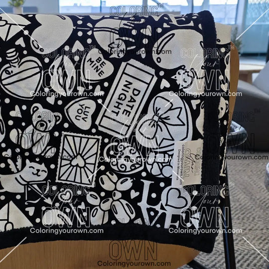 Color Your Own Blanket Valentines day blanket draped over a chair not colored, close up