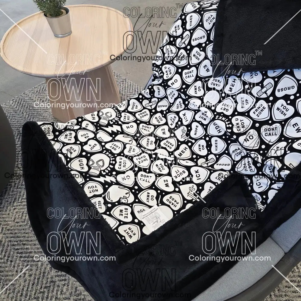 Color Your Own Blanket Anti-Valentines day blanket draped over a chair, not colored