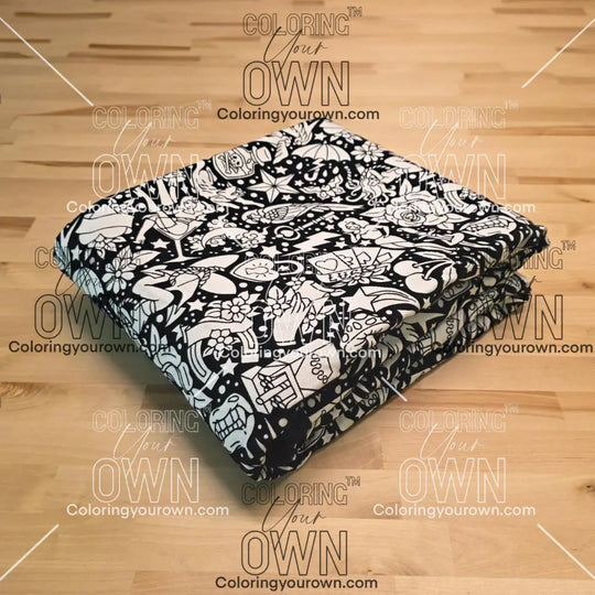 Uncolored classic tattoo styles and patterns blanket folded on a table