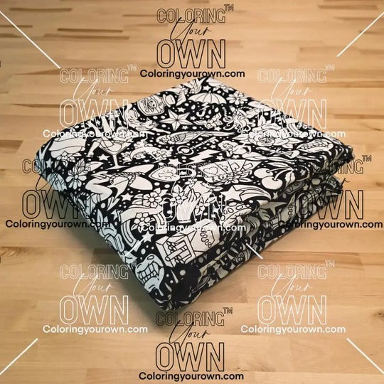 Uncolored classic tattoo styles and patterns blanket folded on a table