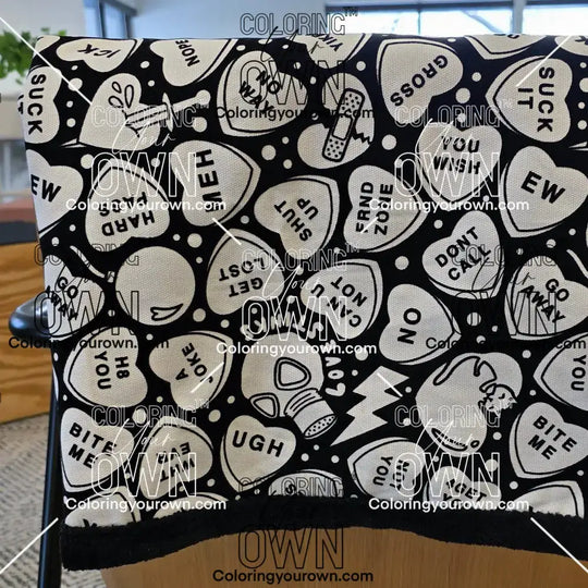 Color Your Own Blanket Anti-Valentines day blanket draped over a couch, not colored, close up