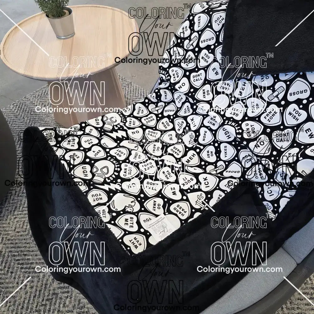 Color Your Own Blanket Anti-Valentines day blanket draped over a chair, not colored