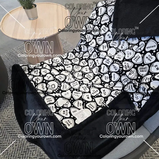 Color Your Own Blanket Anti-Valentines day blanket draped over a chair, not colored