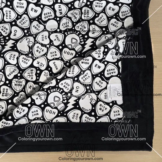 Color Your Own Blanket Anti-Valentines day blanket layed out on a table not colored, close up