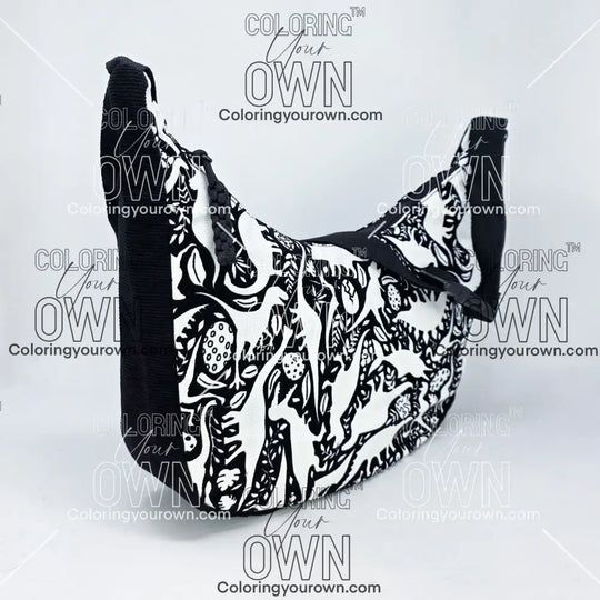three-quarter view of the dinosaur coloring crossbody bag which features a black strap, black corduroy base, and a buckle quick release.