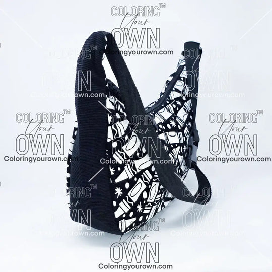 three quarter view of the crayon coloring crossbody bag which features a black strap, black corduroy base, and a buckle quick release.