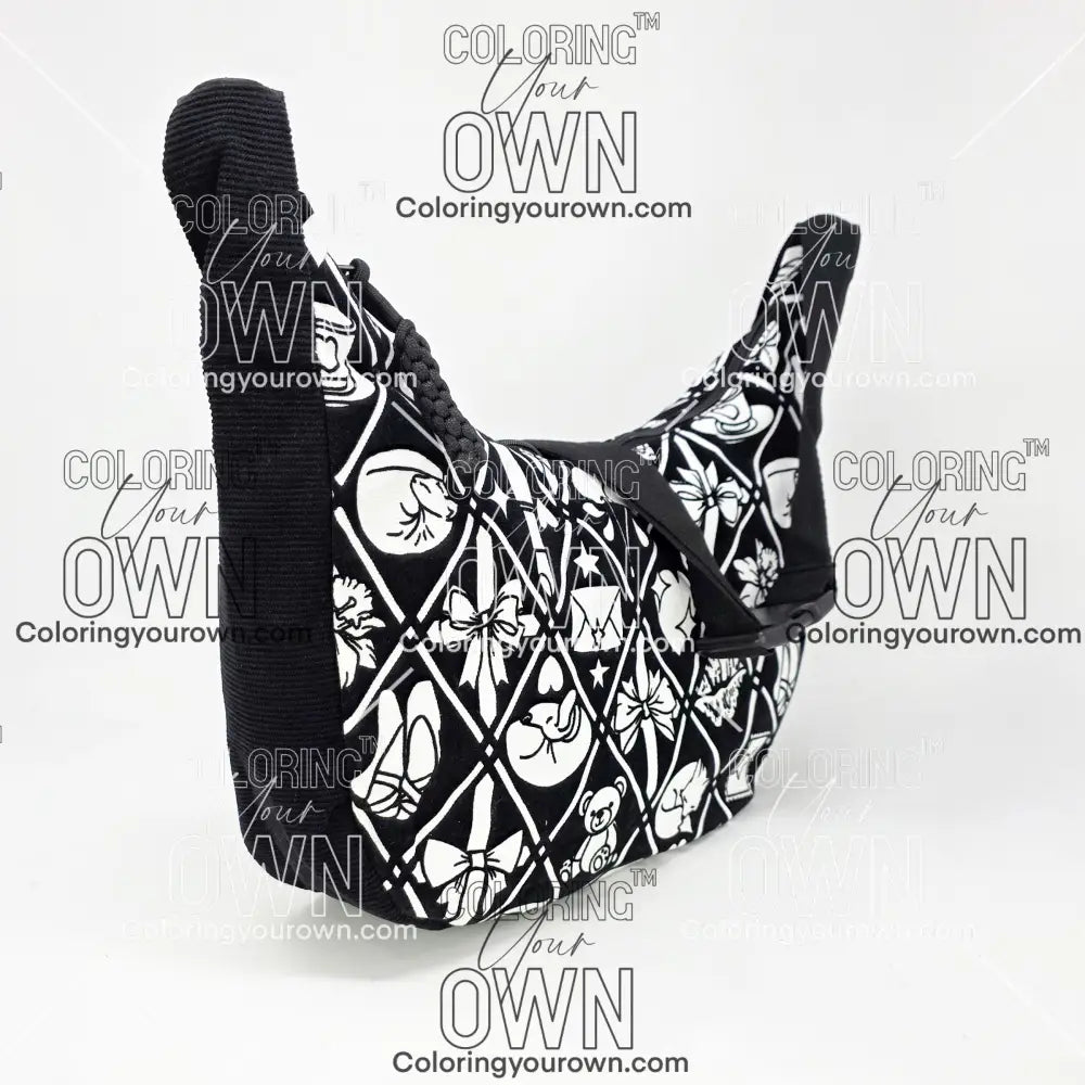 three quarter view of the coquette coloring crossbody bag which features a black strap, black corduroy base, and a buckle quick release.