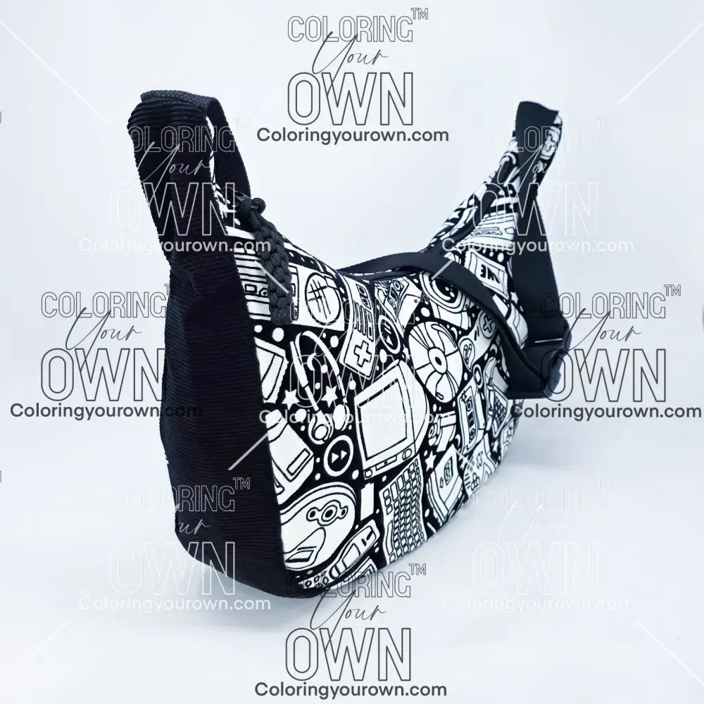 three quarter view of the retro tech coloring crossbody bag which features a black strap, black corduroy base, and a buckle quick release.