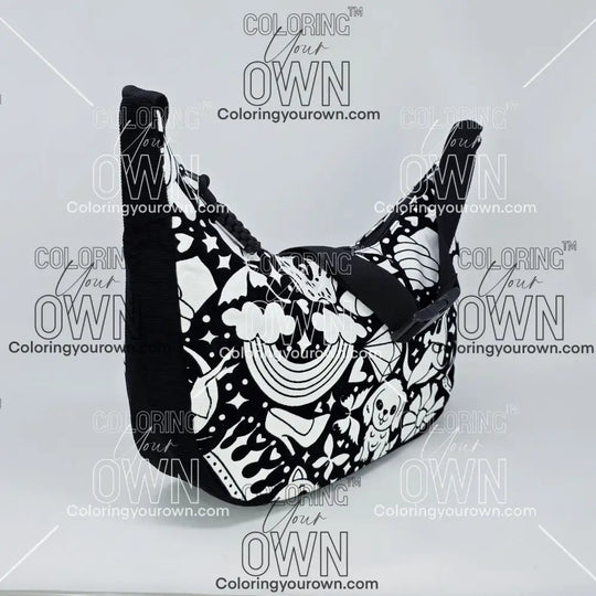 three quarter view of the Happy Doodle 2 coloring crossbody bag which features a black strap, black corduroy base, and a buckle quick release.