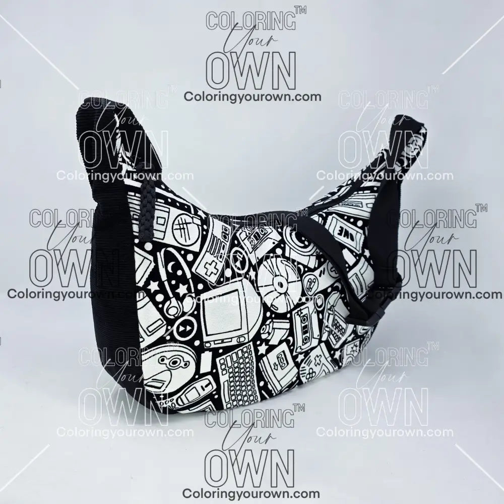 three quarter view of the retro tech coloring crossbody bag which features a black strap, black corduroy base, and a buckle quick release.