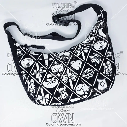Front view of the coquette coloring crossbody bag which features a black strap, black corduroy base, and a buckle quick release.