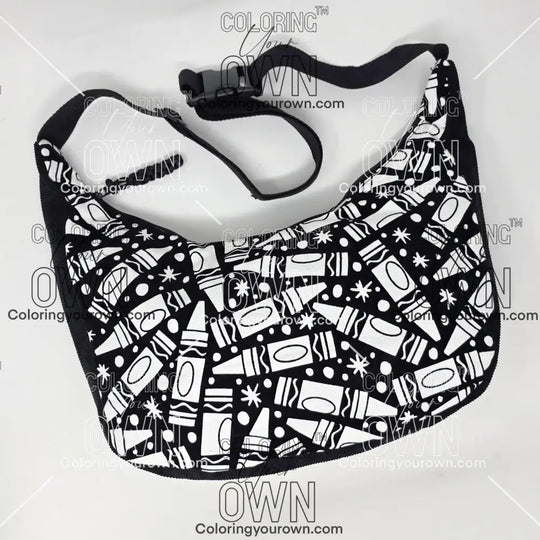 Front view of the crayon coloring crossbody bag which features a black strap, black corduroy base, and a buckle quick release.