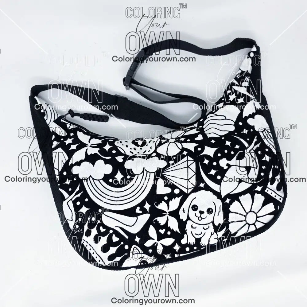 front view of the Happy Doodle 2 coloring crossbody bag which features a black strap, black corduroy base, and a buckle quick release.