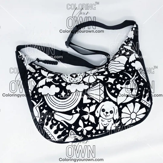 front view of the happy doodle 2 coloring your own crossbody bag not colored with a black strap and quick release buckle. 