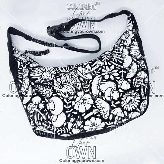 Front view of the mushroom 2 coloring crossbody bag which features a black strap, black corduroy base, and a buckle quick release.
