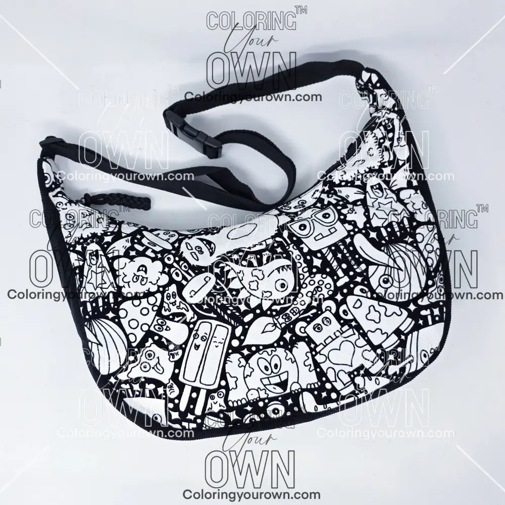 Front view of the silly monsters coloring crossbody bag which features a black strap, black corduroy base, and a buckle quick release.