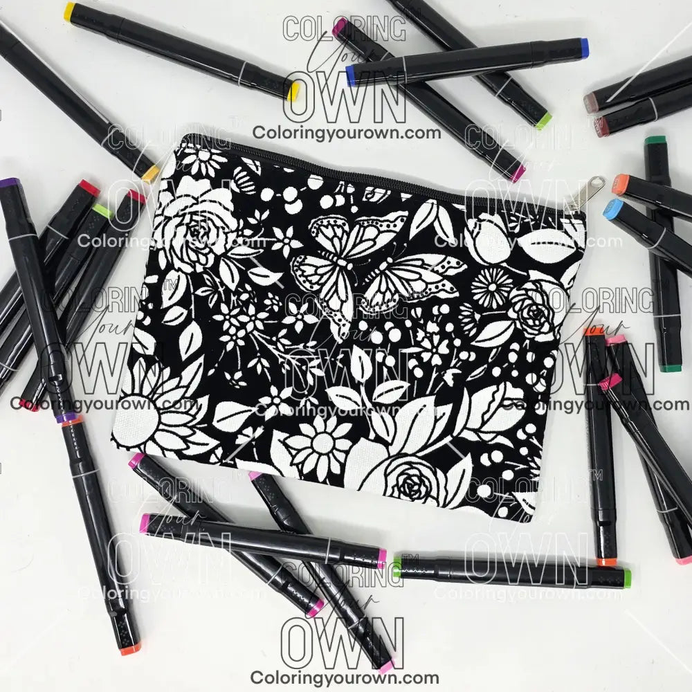 Photo of a black and white flat pencil pouch with lots of colorful markers beside it indicating the customer gets to color it when they receive theirs. This is the same bag as the pencil case - Side B - this bag has images of vintage flowers on it