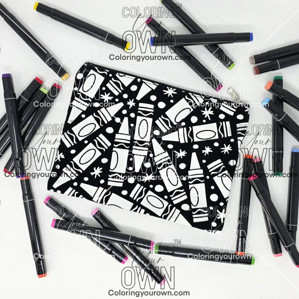 Photo of a black and white flat makeup bag with lots of colorful markers beside it indicating the customer gets to color it when they receive theirs. This is the same bag as the pencil case - Side A