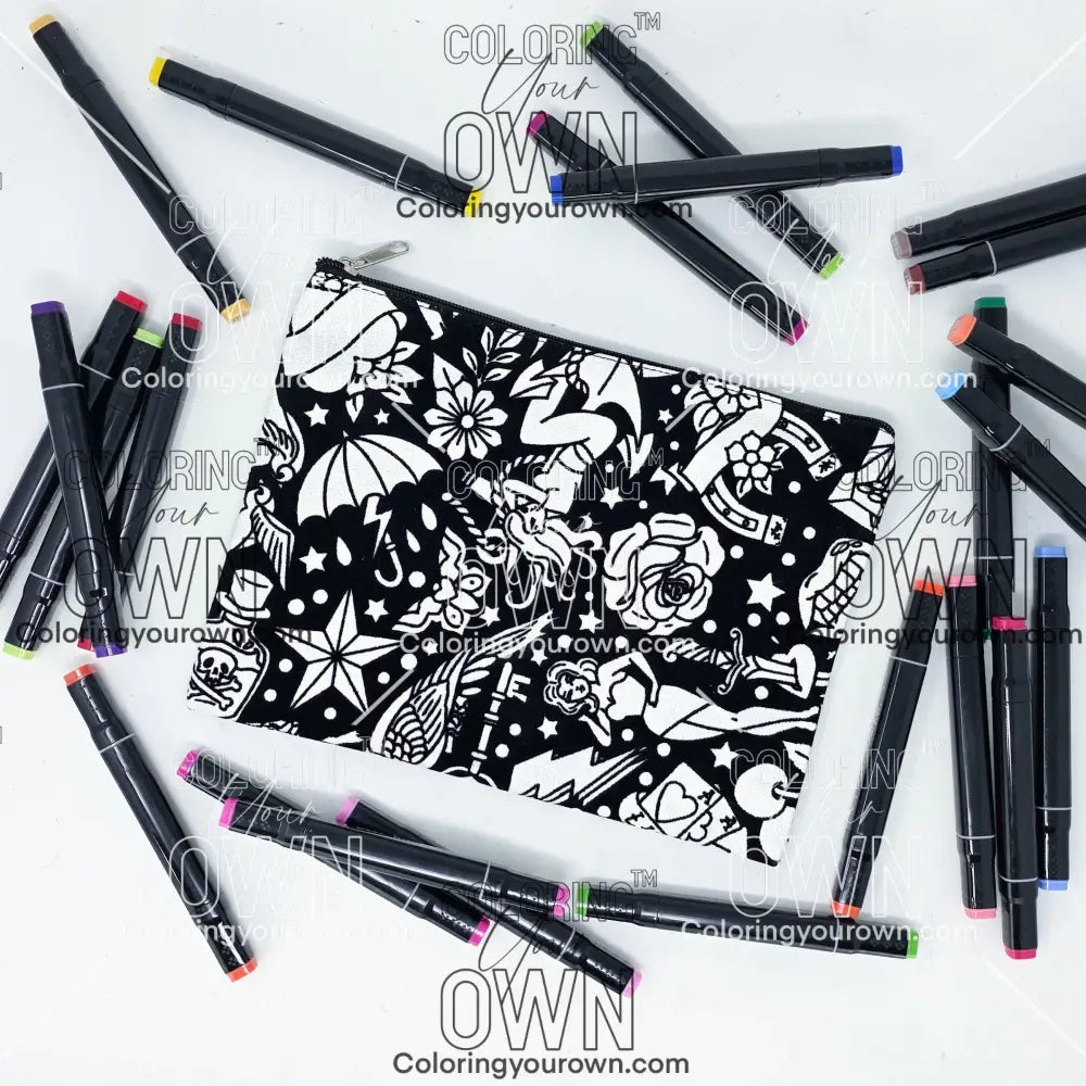 Photo of a black and white flat pencil pouch with lots of colorful markers beside it indicating the customer gets to color it when they receive theirs. This is the same bag as the pencil case and makeup bag - Side B - this bag has images of traditional tattoo-inspired graphics including pinup girls, cigarettes, roses, birds, vampire lips, cards, poison bottles, and more