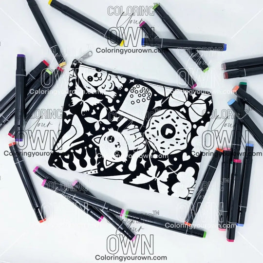 Photo of a black and white flat pencil pouch with lots of colorful markers beside it indicating the customer gets to color it when they receive theirs. This is the same bag as the pencil case - Side A - this bag has images of happy doodles on it