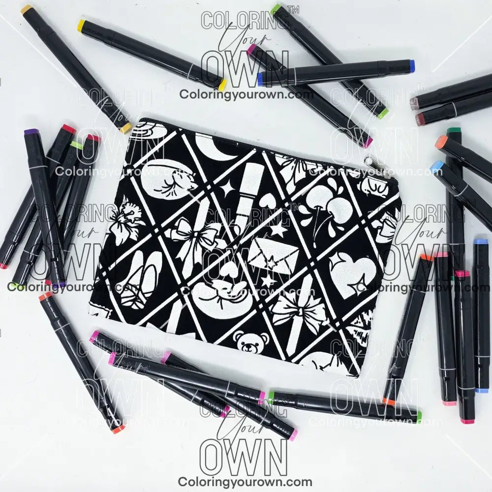 Photo of a black and white flat pencil pouch with lots of colorful markers beside it indicating the customer gets to color it when they receive theirs. This is the same bag as the pencil case and makeup bag - Side A - this bag has images of Coquette-inspired illustrations including a swan, a paw print, bows, a moon, stars, a bunny on it cherries and more