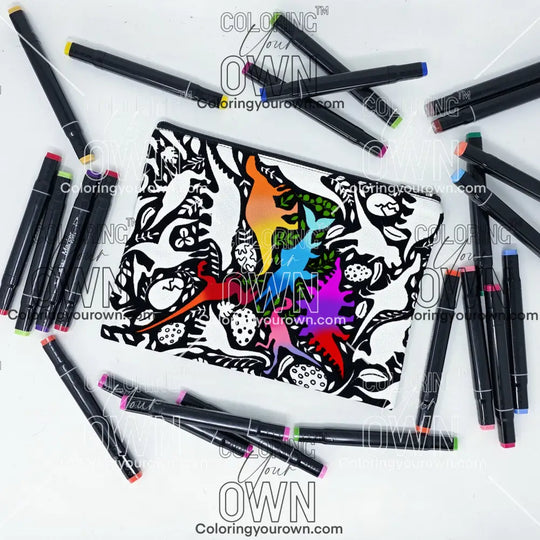 Photo of a black and white flat pencil pouch with lots of colorful markers beside it indicating the customer gets to color it when they receive theirs. This is the same bag as the pencil case and makeup bag - Side B - this bag has images of dinosaurs, foliage, and eggs