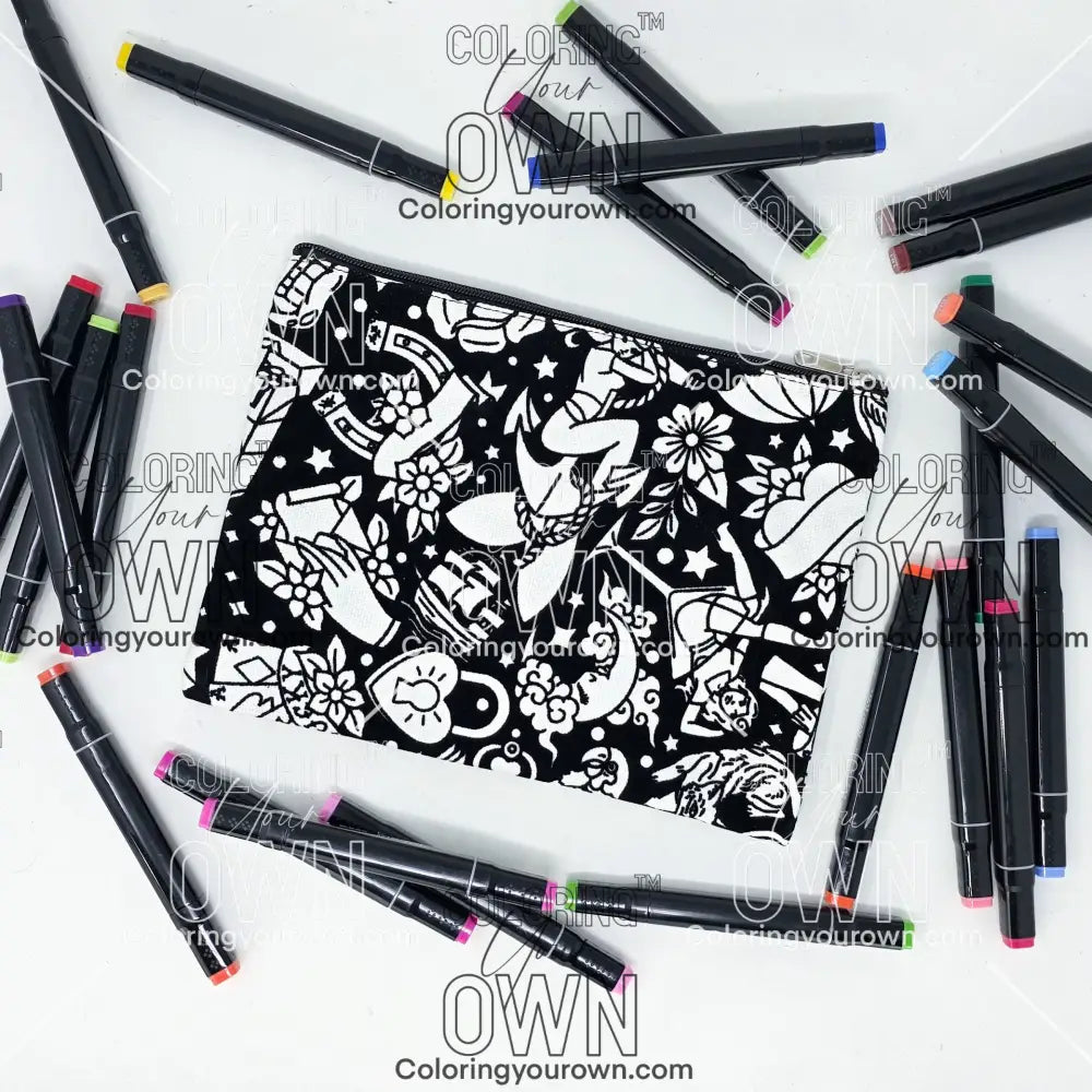 Photo of a black and white flat pencil pouch with lots of colorful markers beside it indicating the customer gets to color it when they receive theirs. This is the same bag as the pencil case and makeup bag - Side A - this bag has images of traditional tattoo-inspired graphics including pinup girls, cigarettes, roses, birds, vampire lips, cards, poison bottles, and more