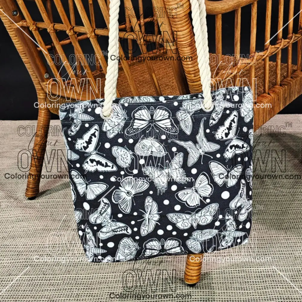 photo of an uncolored butterfly color your own tote hanging on the back of a wicker chair