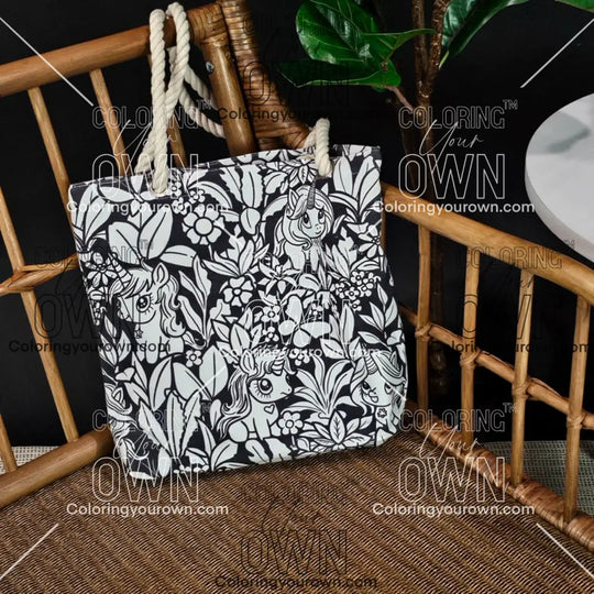 photo of an uncolored unicorn color your own tote sitting on a wicker chair