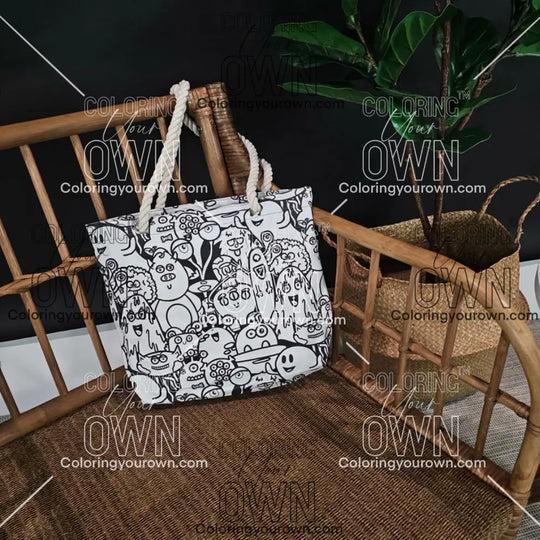photo of an uncolored coloring your own monster tote sitting on a wicker chair. 