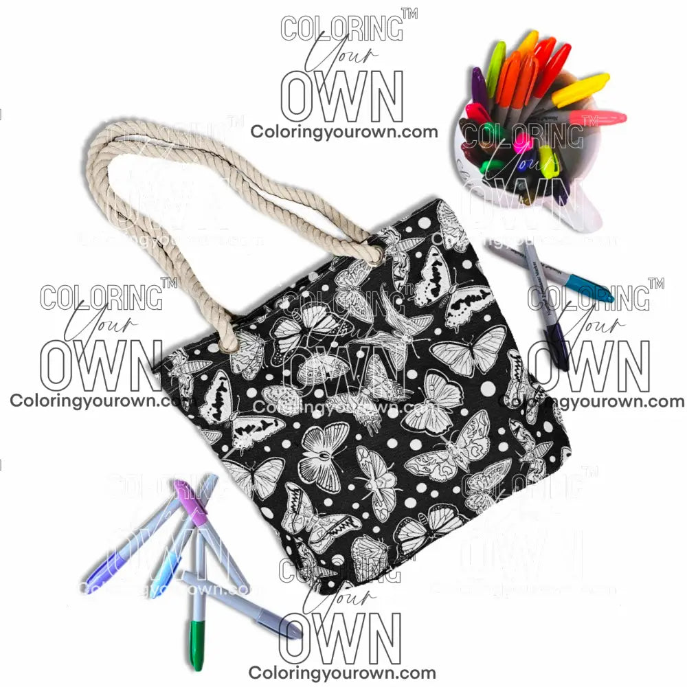 photo of an uncolored color your own butterfly tote bag surrounded by markers