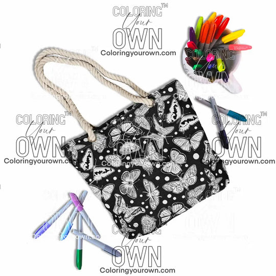 photo of an uncolored color your own butterfly tote bag surrounded by markers